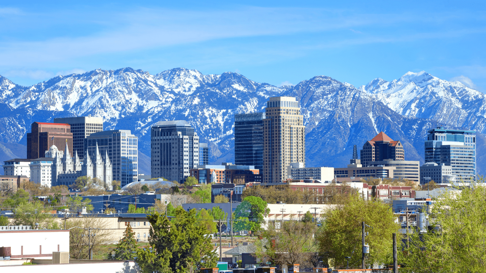 Salt Lake City skyline with mountain backdrop representing Northern Utah commercial service area